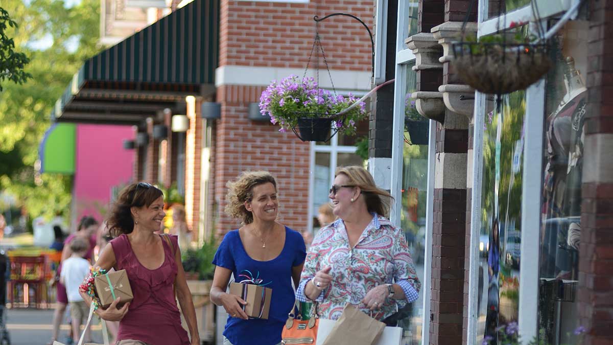 A group carrying shopping bags along Elmwood Avenue in Buffalo, NY