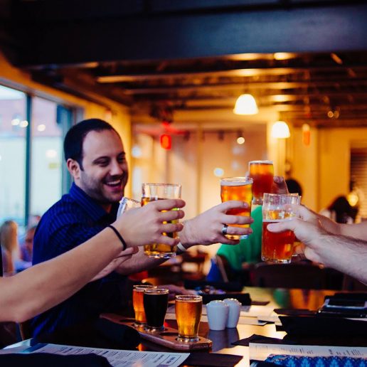 Group cheering beer at Big Ditch Brewing