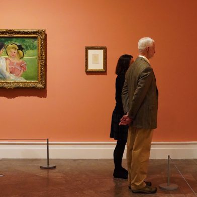 People admiring art at a gallery