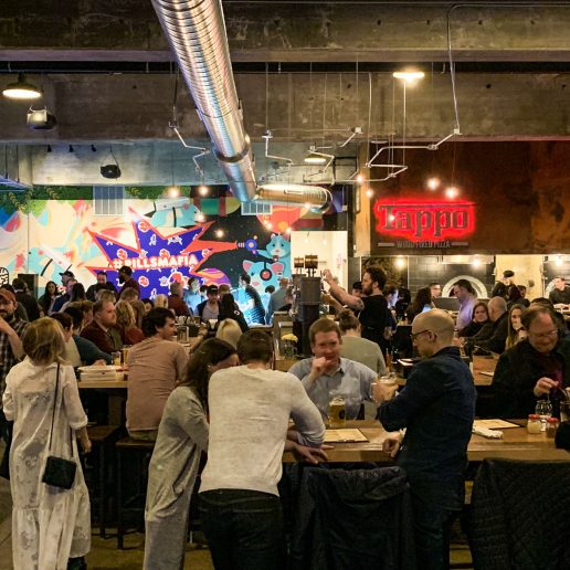 Patrons at a warehouse bar