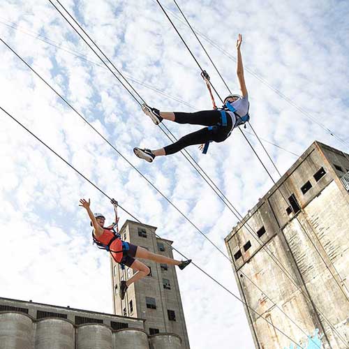 People riding a zipline