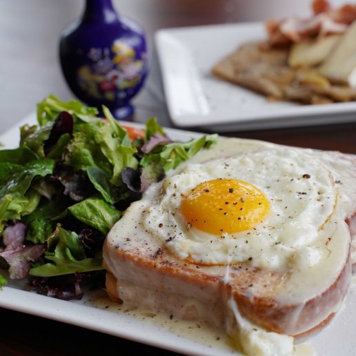 Breakfast plate with salad, toast and egg