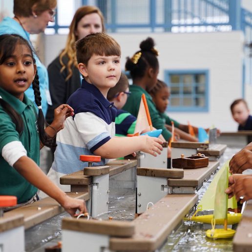 Explore & Children making boats at More Children's Museum